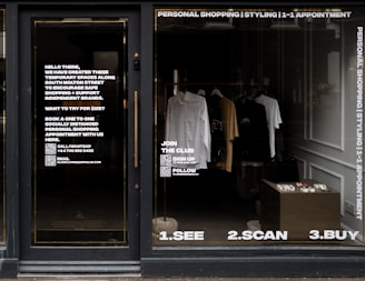 white dress shirt hanging on brown wooden cabinet