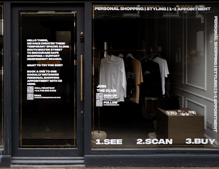 white dress shirt hanging on brown wooden cabinet