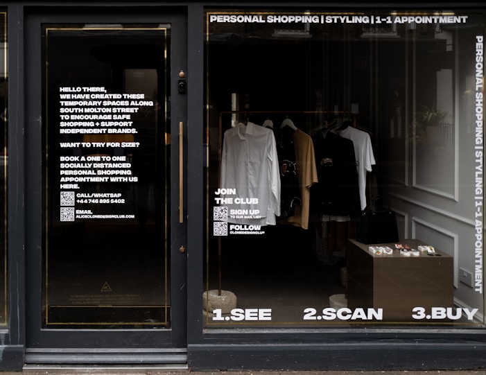 white dress shirt hanging on brown wooden cabinet