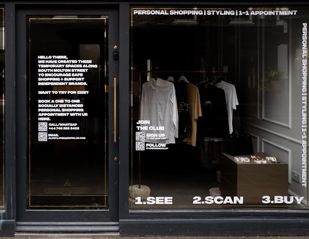 white dress shirt hanging on brown wooden cabinet