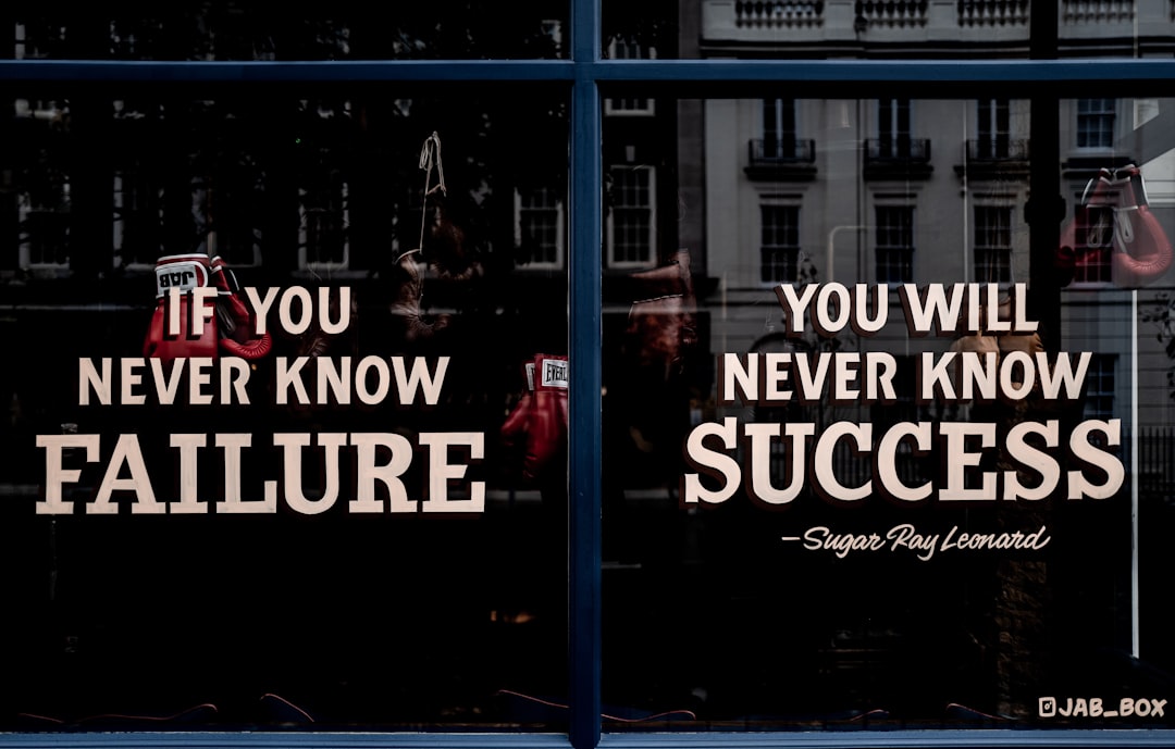 text, Motivational sign in the window of a boxing gym.
