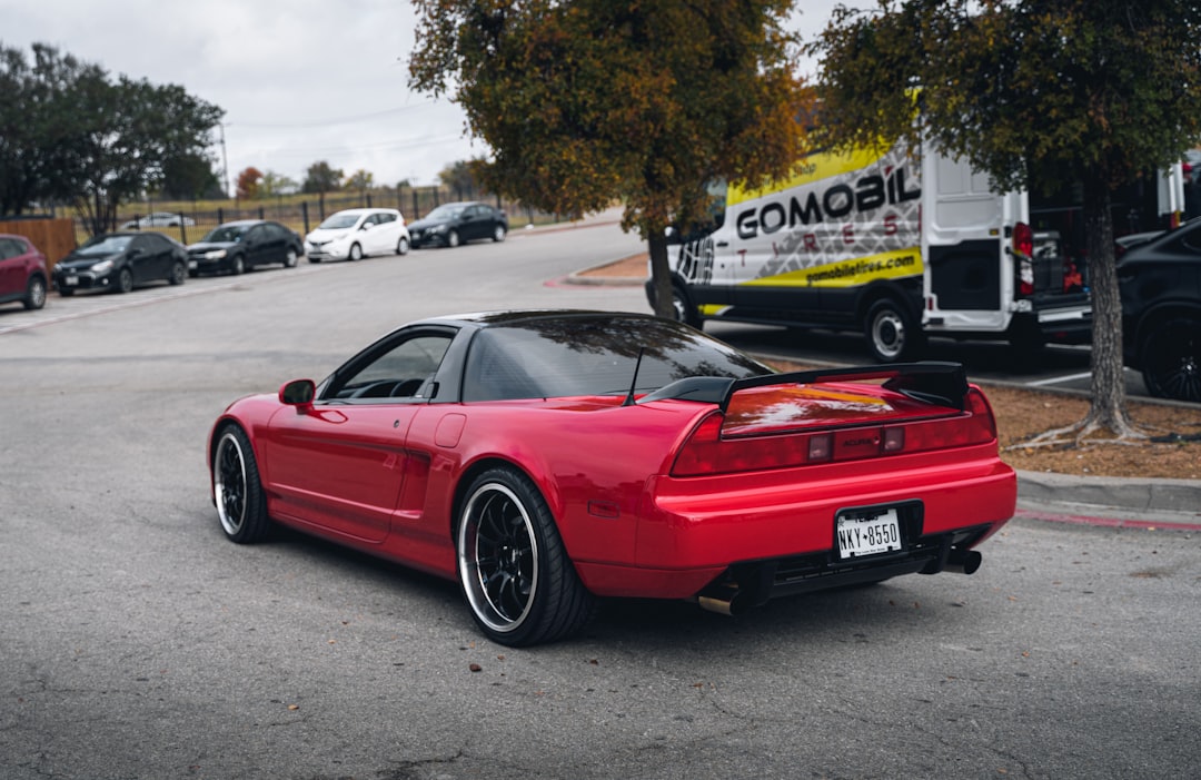 red ferrari 458 italia parked on parking lot during daytime