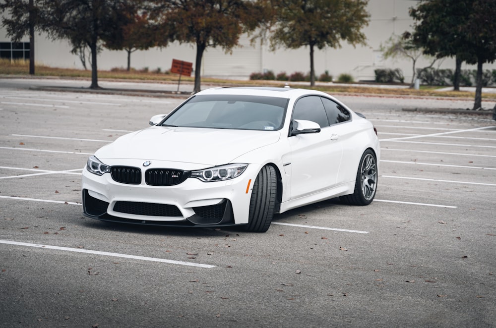 white bmw m 3 on road during daytime