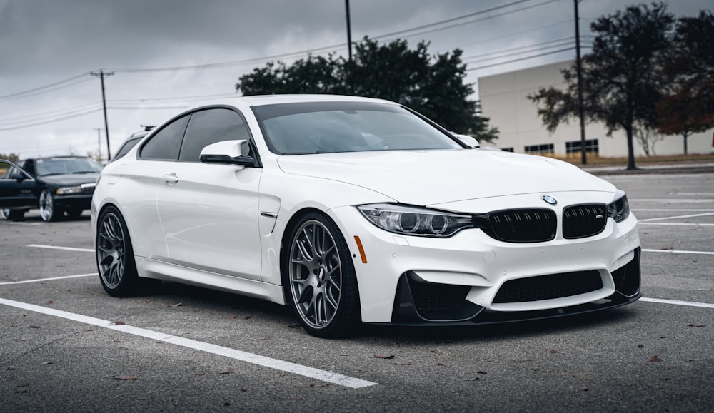 white bmw m 3 coupe on road during daytime