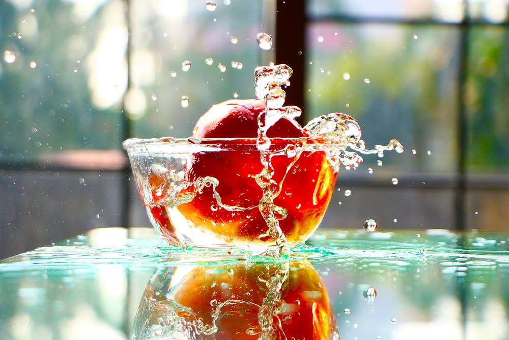 clear drinking glass with orange liquid