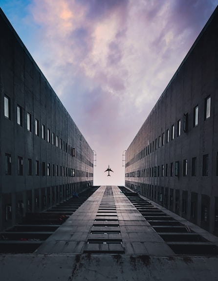 black concrete building under cloudy sky during daytime
