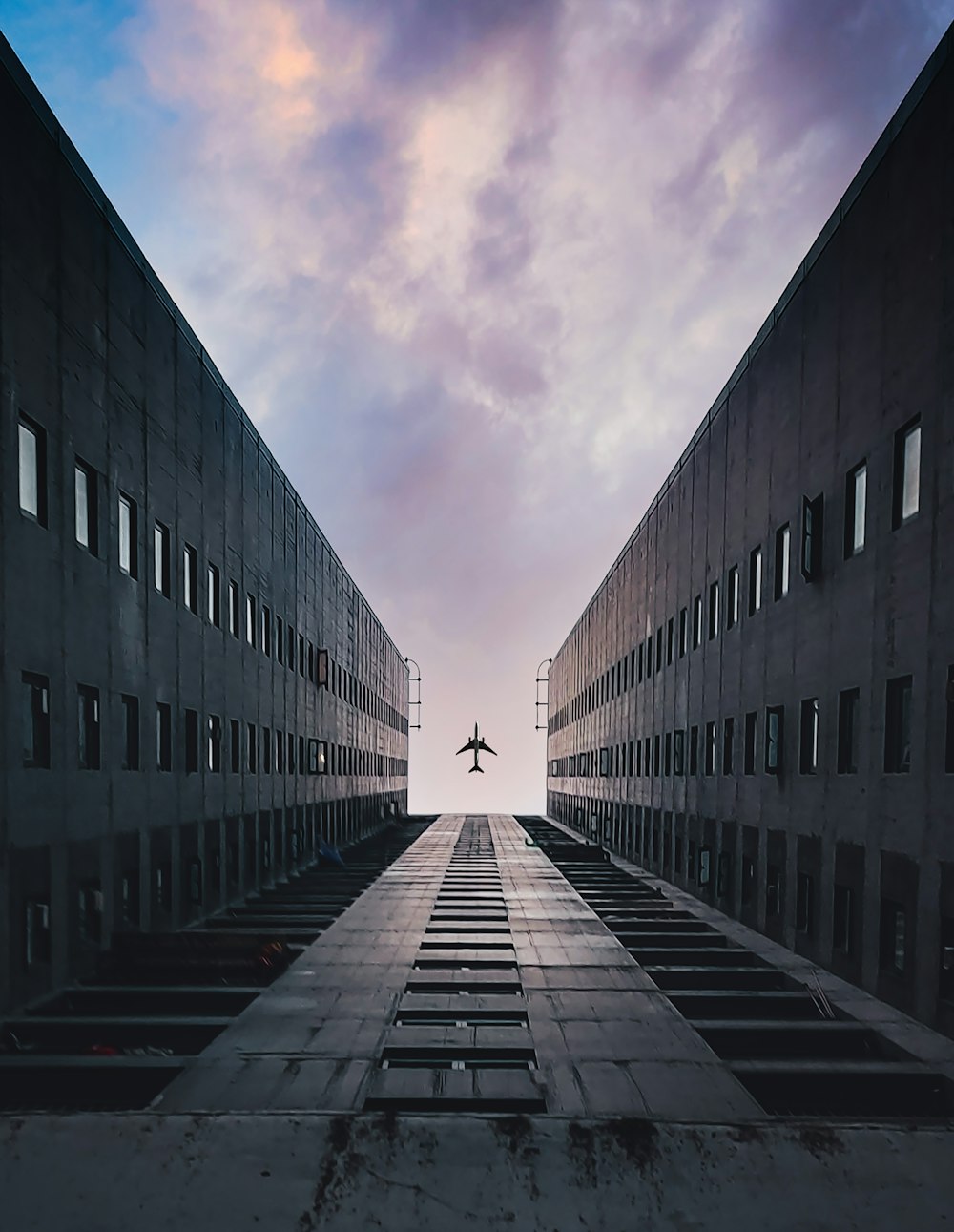 black concrete building under cloudy sky during daytime