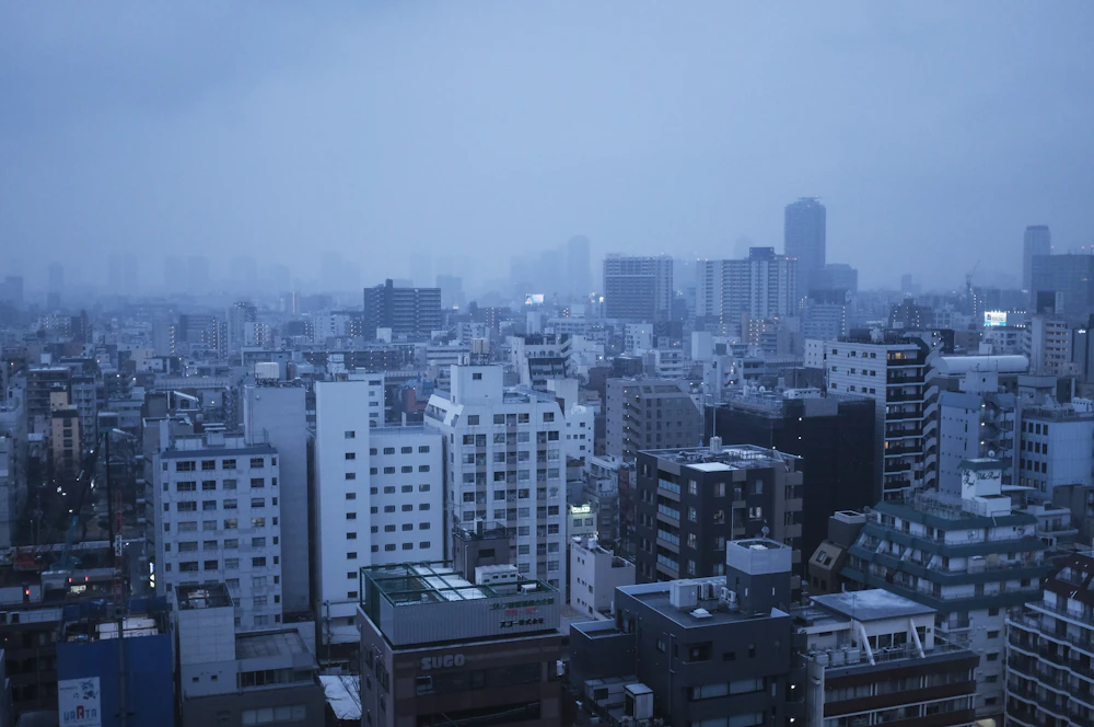 Tokyo street at dawn in fog — the quiet hour before the city wakes