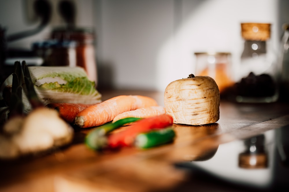 sliced vegetables on brown wooden chopping board