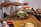 Man happily preparing a healthy meal with fresh vegetables on the counter