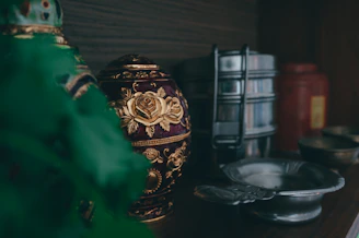 gold and black floral jar