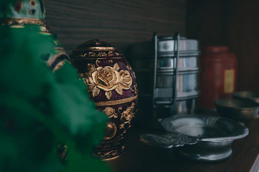 gold and black floral jar