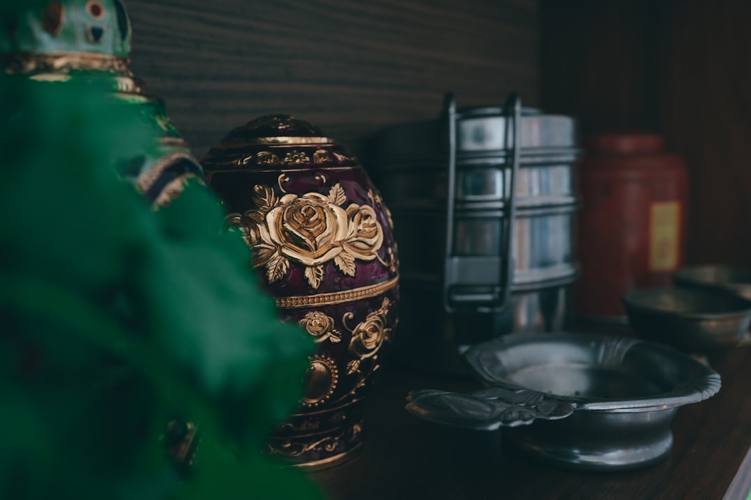 gold and black floral jar