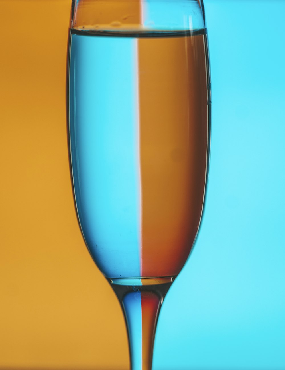blue and yellow wine glass
