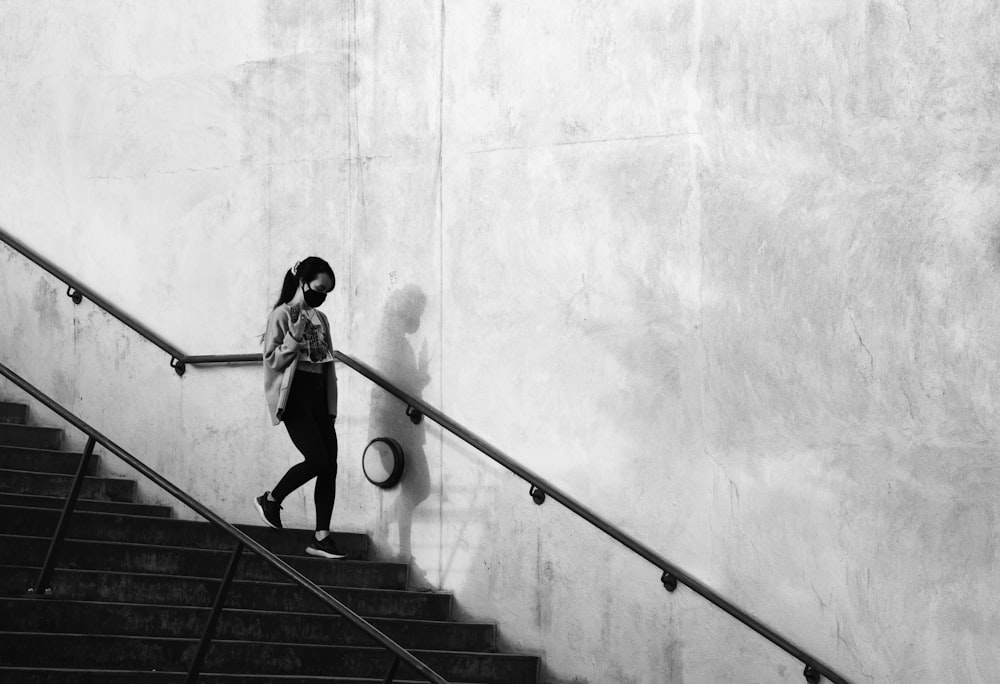 man in black t-shirt and black pants playing skateboard