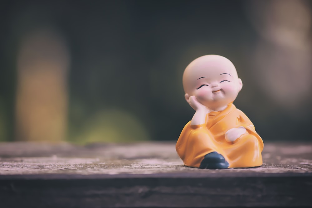 baby in yellow shirt figurine