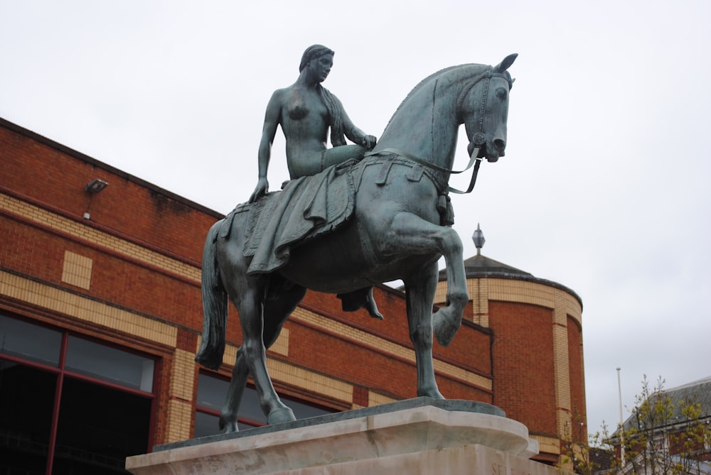 black horse statue on brown building