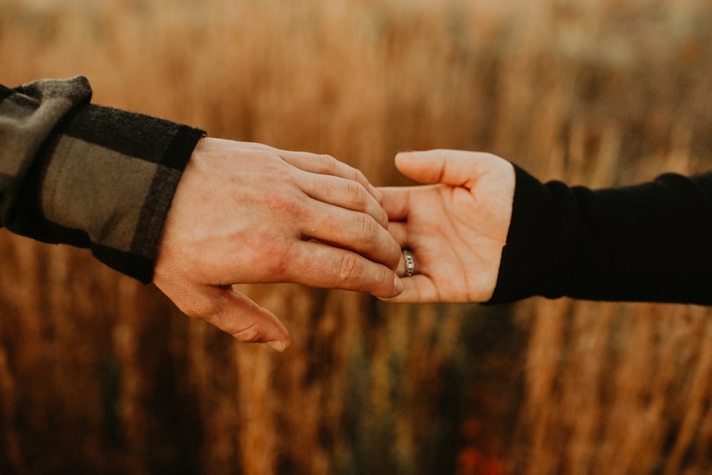 man and woman holding hands