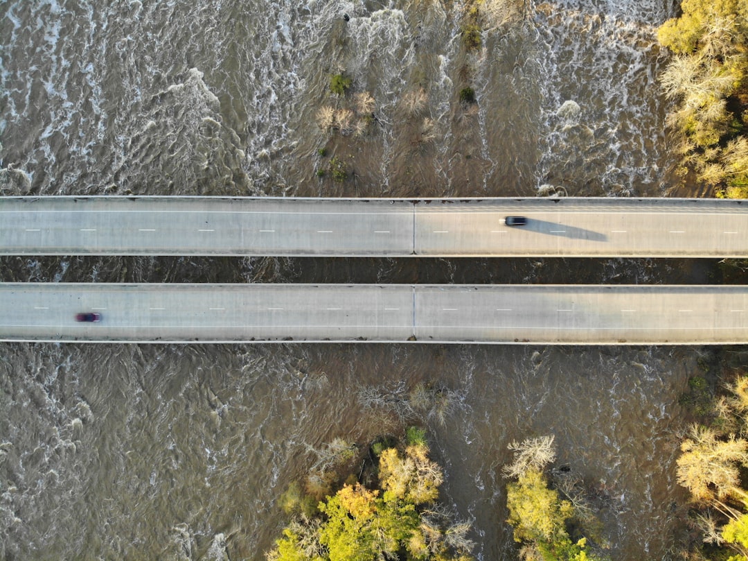 gray metal bridge over river, DJI Mavic bird