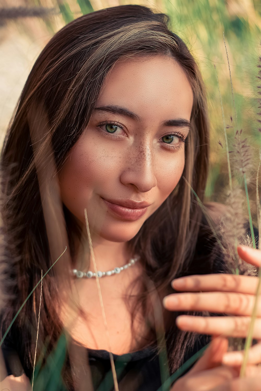 woman in brown fur coat wearing silver necklace