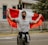 man in gray sweater holding red flag