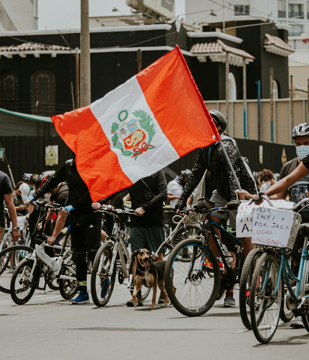 people riding bicycles on road during daytime