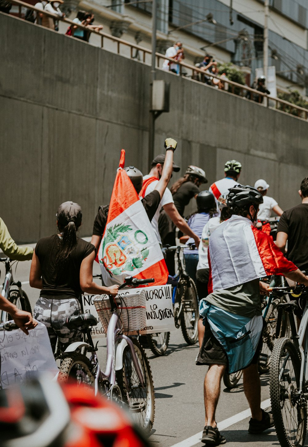 people riding bicycles on road during daytime