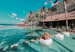 woman in swimming pool during daytime