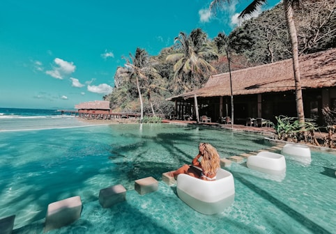 woman in swimming pool during daytime