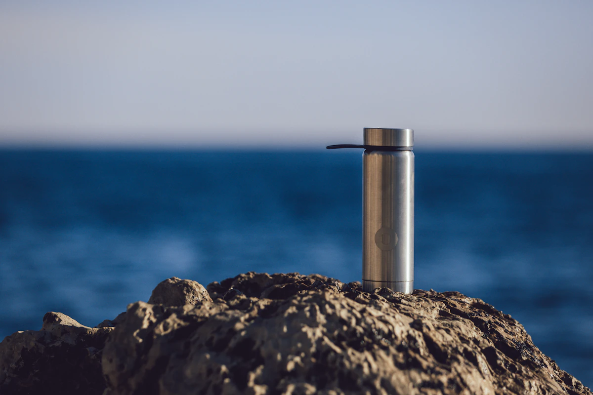Finished stainless steel water bottle outdoors, ready for market
