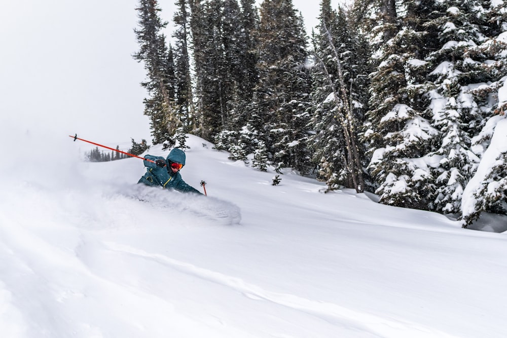 person riding ski blades on snow covered ground during daytime