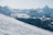 A skier gliding smoothly down a snowy slope, showcasing the thrill of winter sports.