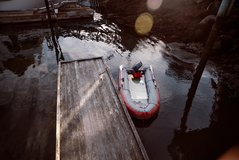 red and white boat on water