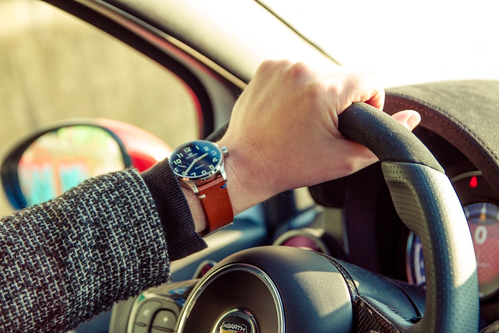 person wearing silver and gold chronograph watch