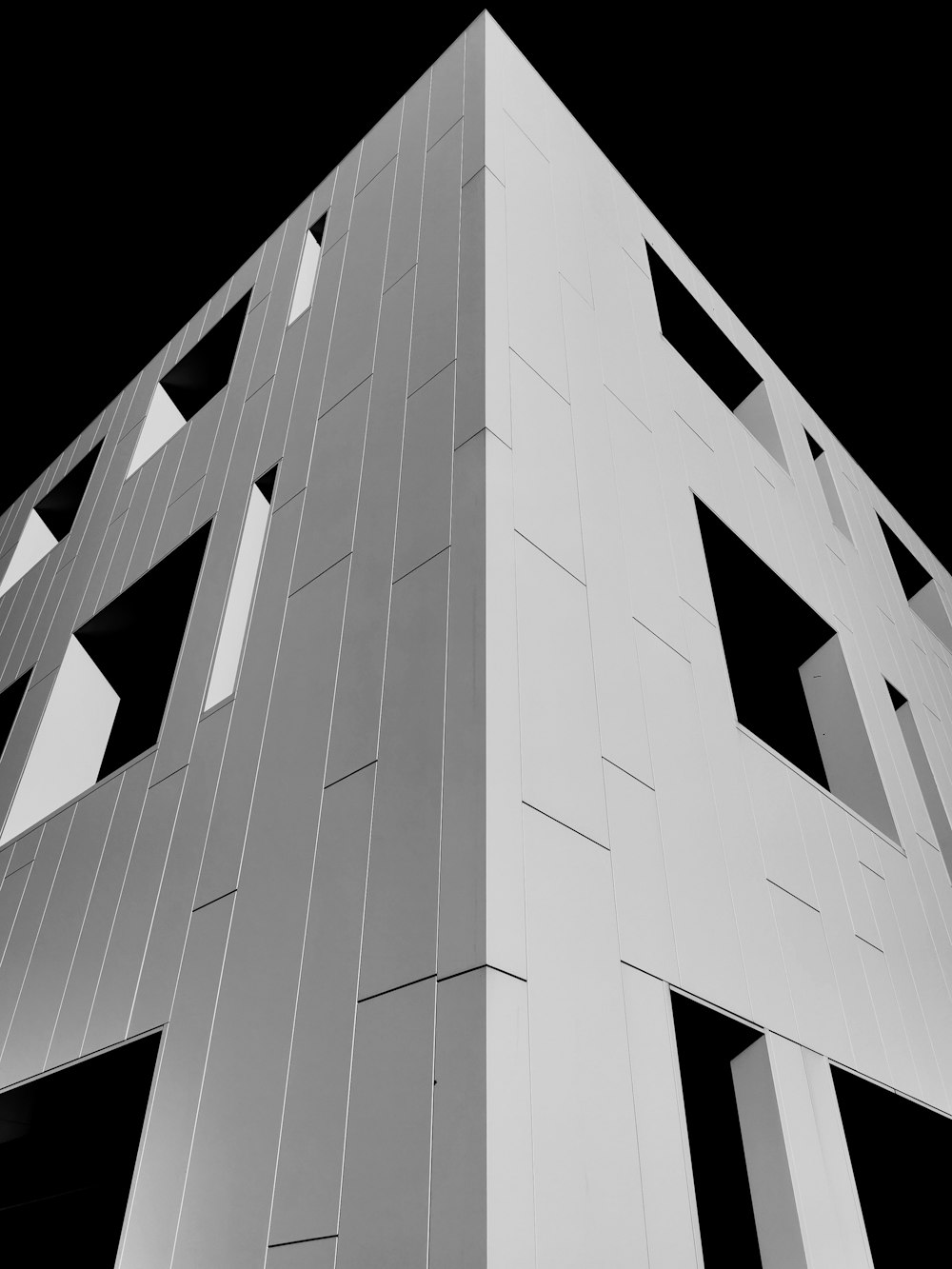 white concrete building with black background