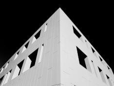white concrete building with black background