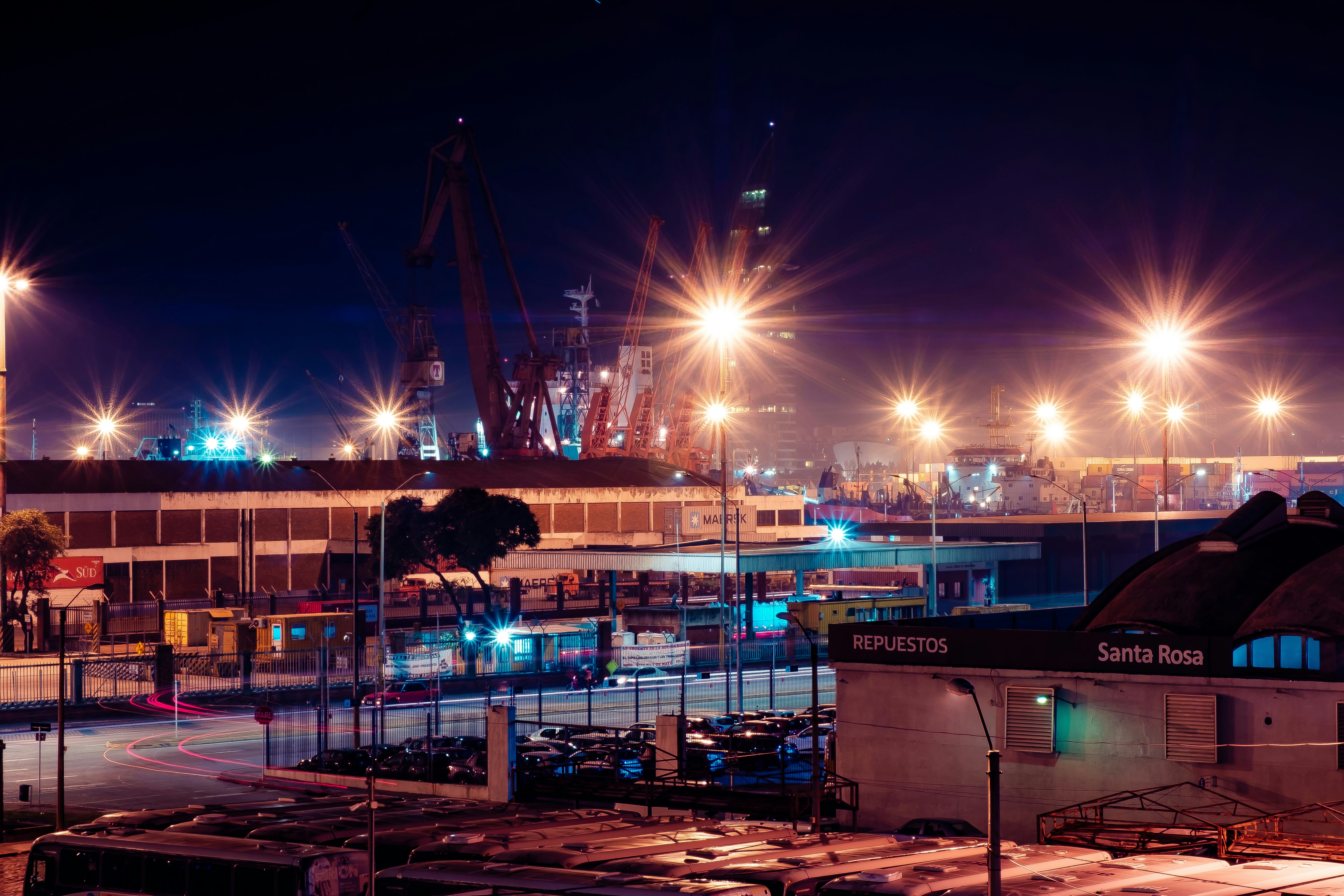 blue and white boat on dock during night time