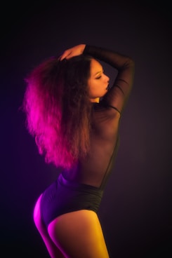 woman in black tank top with pink hair