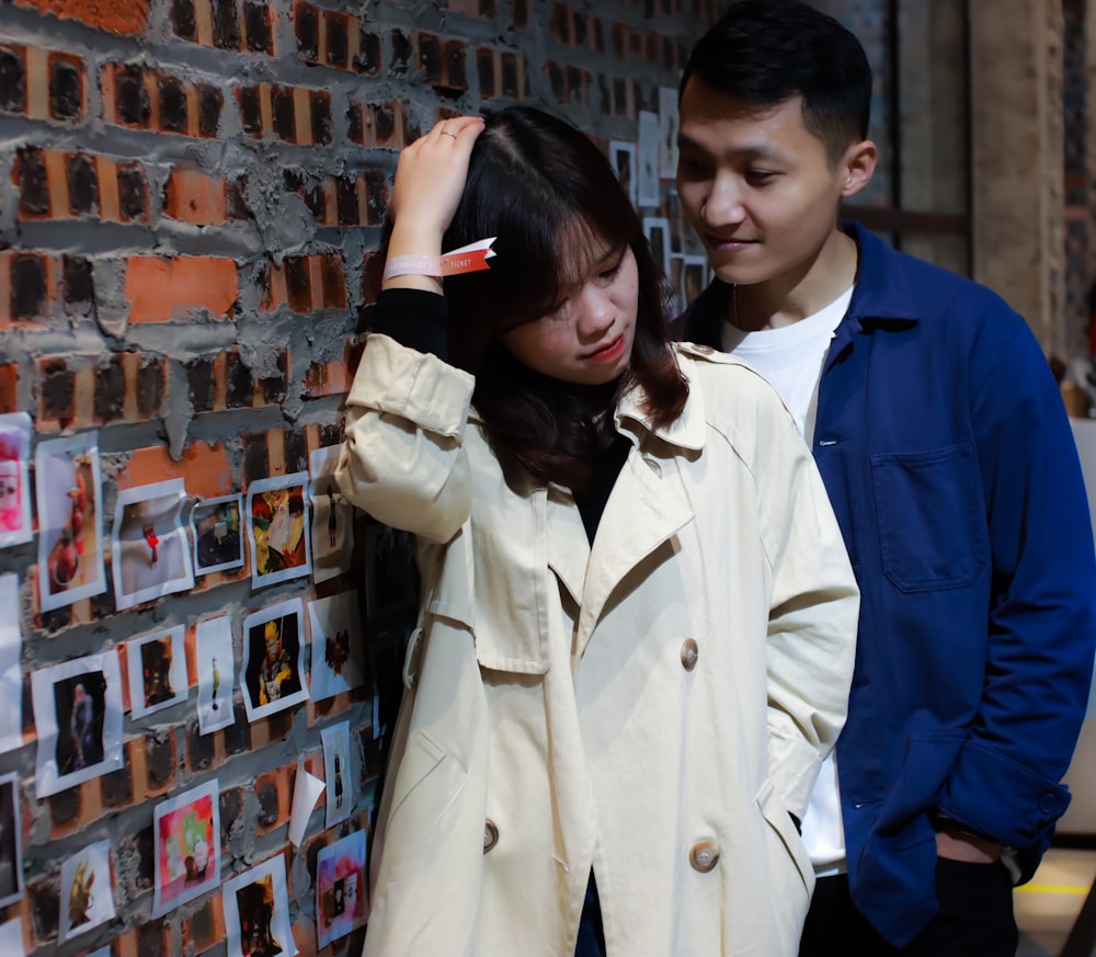 woman in white coat standing beside woman in blue coat