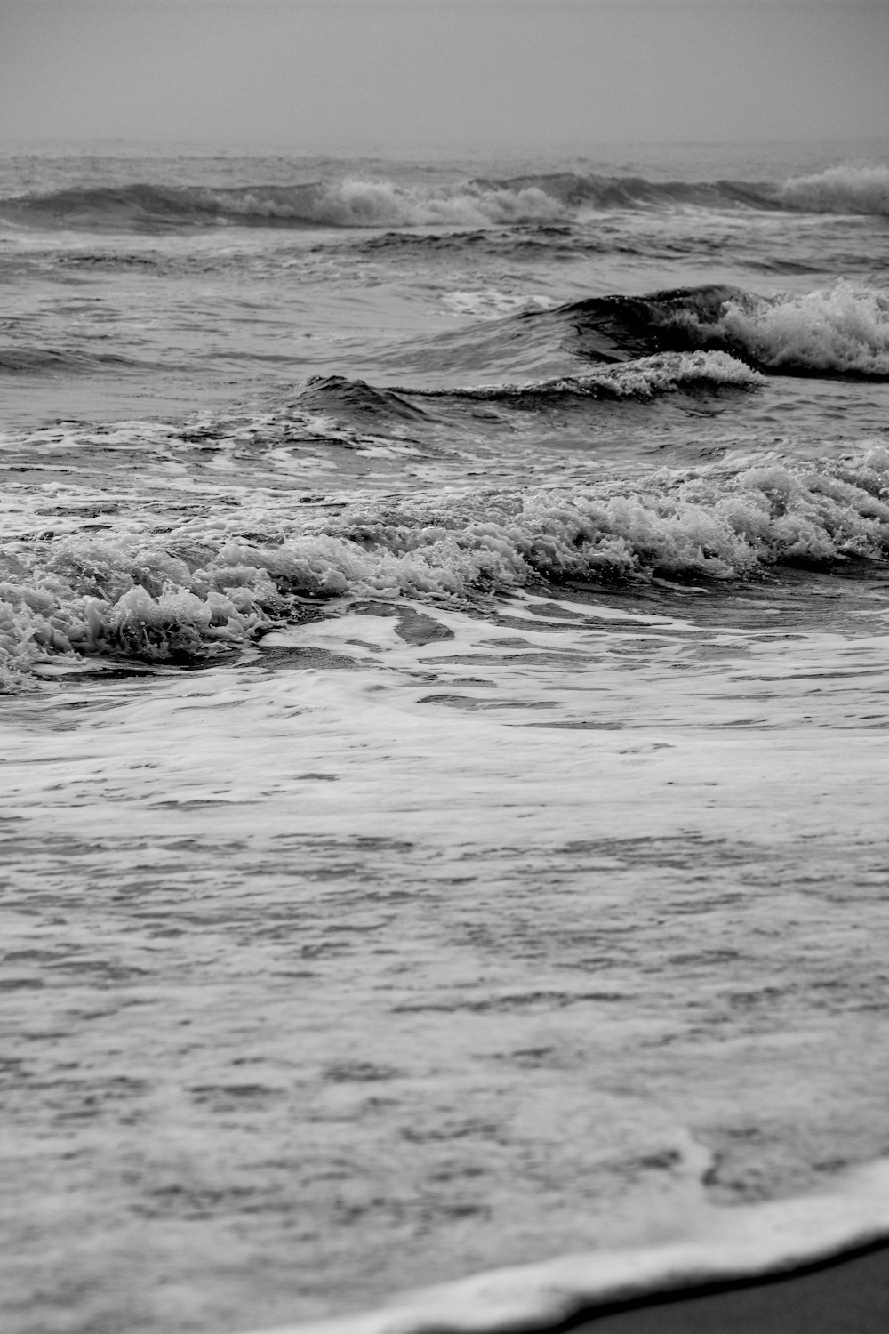 grayscale photo of ocean waves