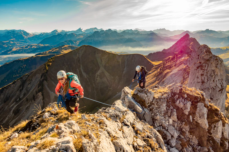 Friends hiking through mountains