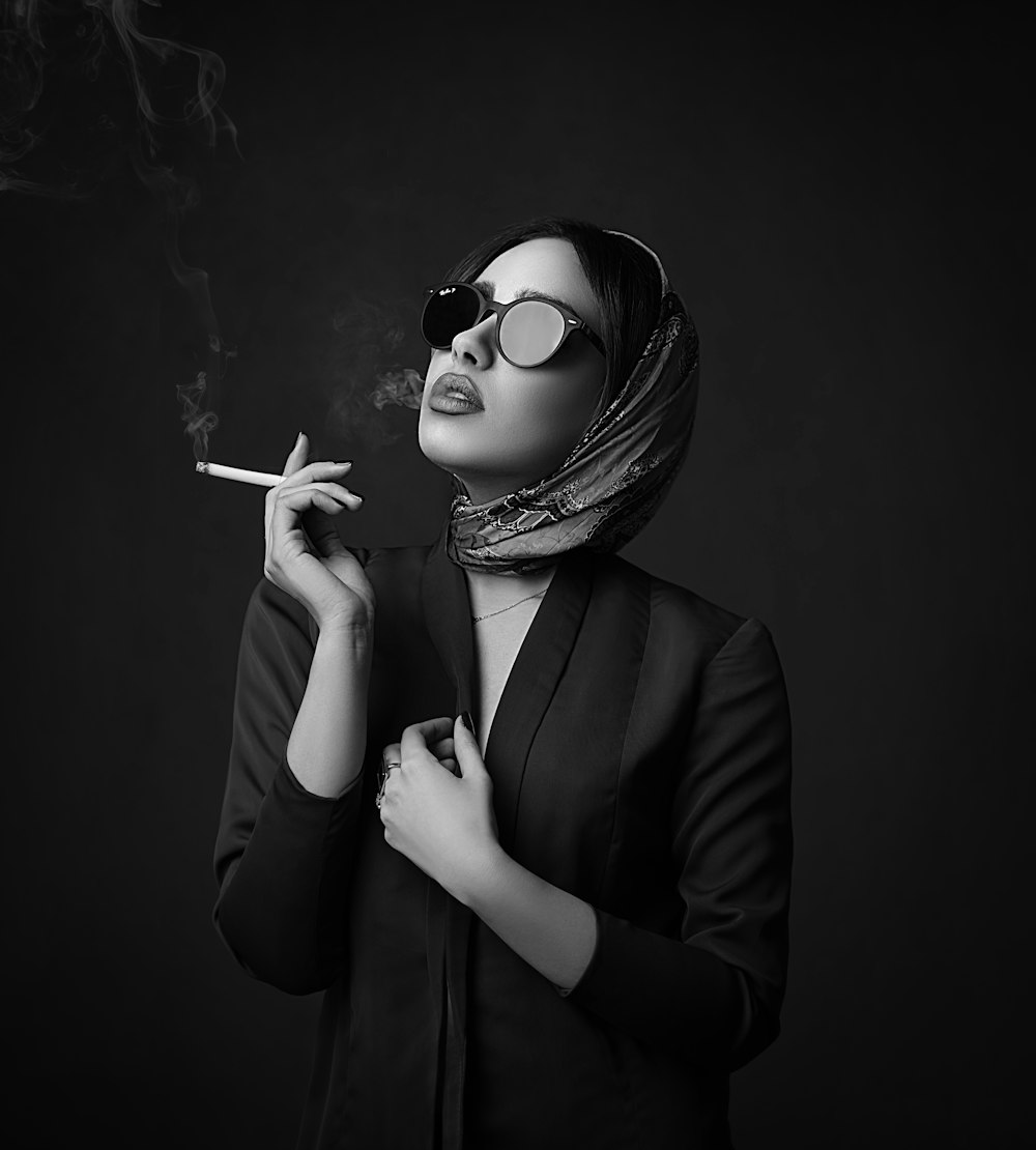 woman in black blazer wearing sunglasses