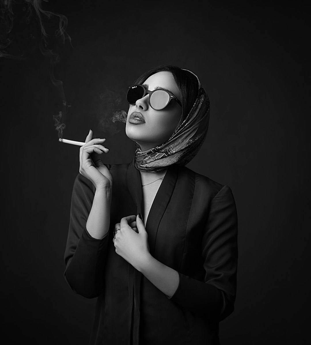 woman in black blazer wearing sunglasses