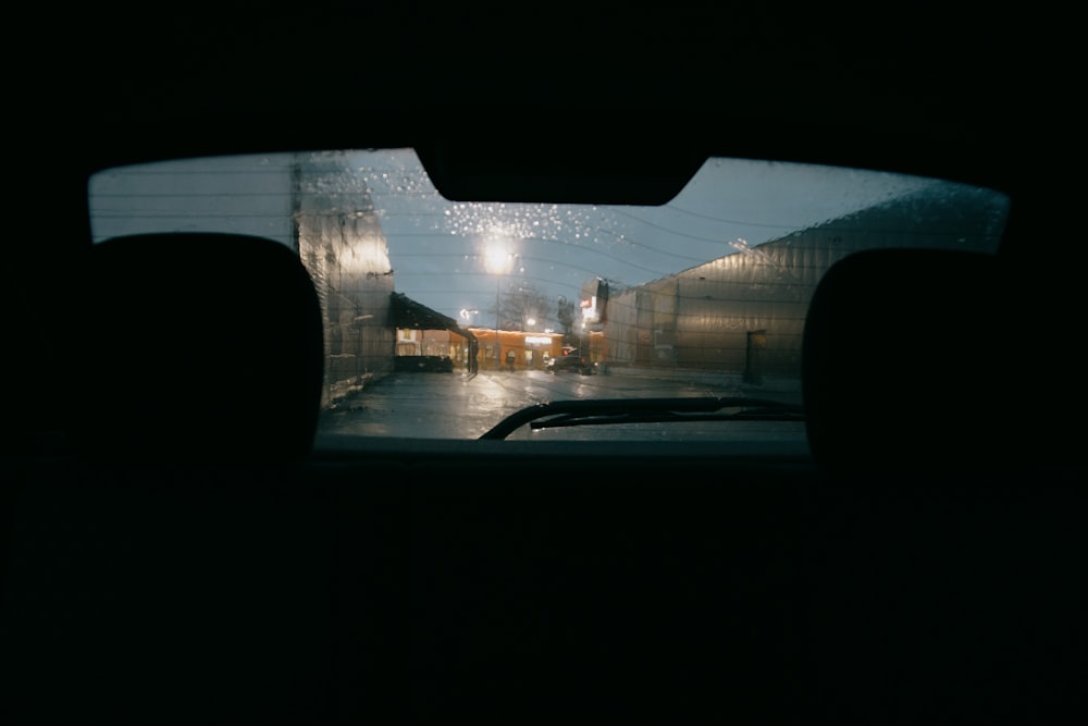 car on road near building during night time