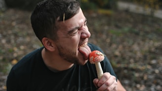 man in black crew neck shirt eating ice cream