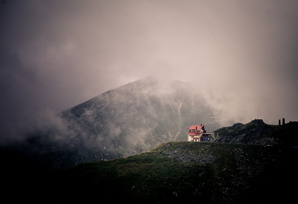 red and white house on top of mountain