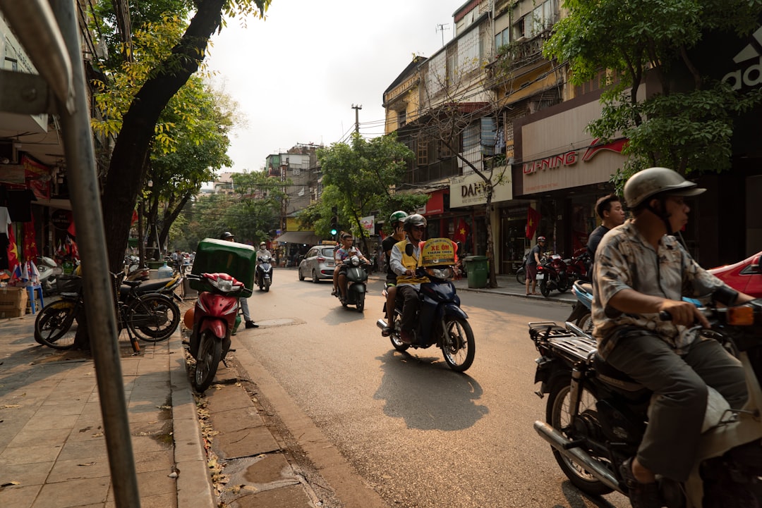 people riding motorcycle on road during daytime