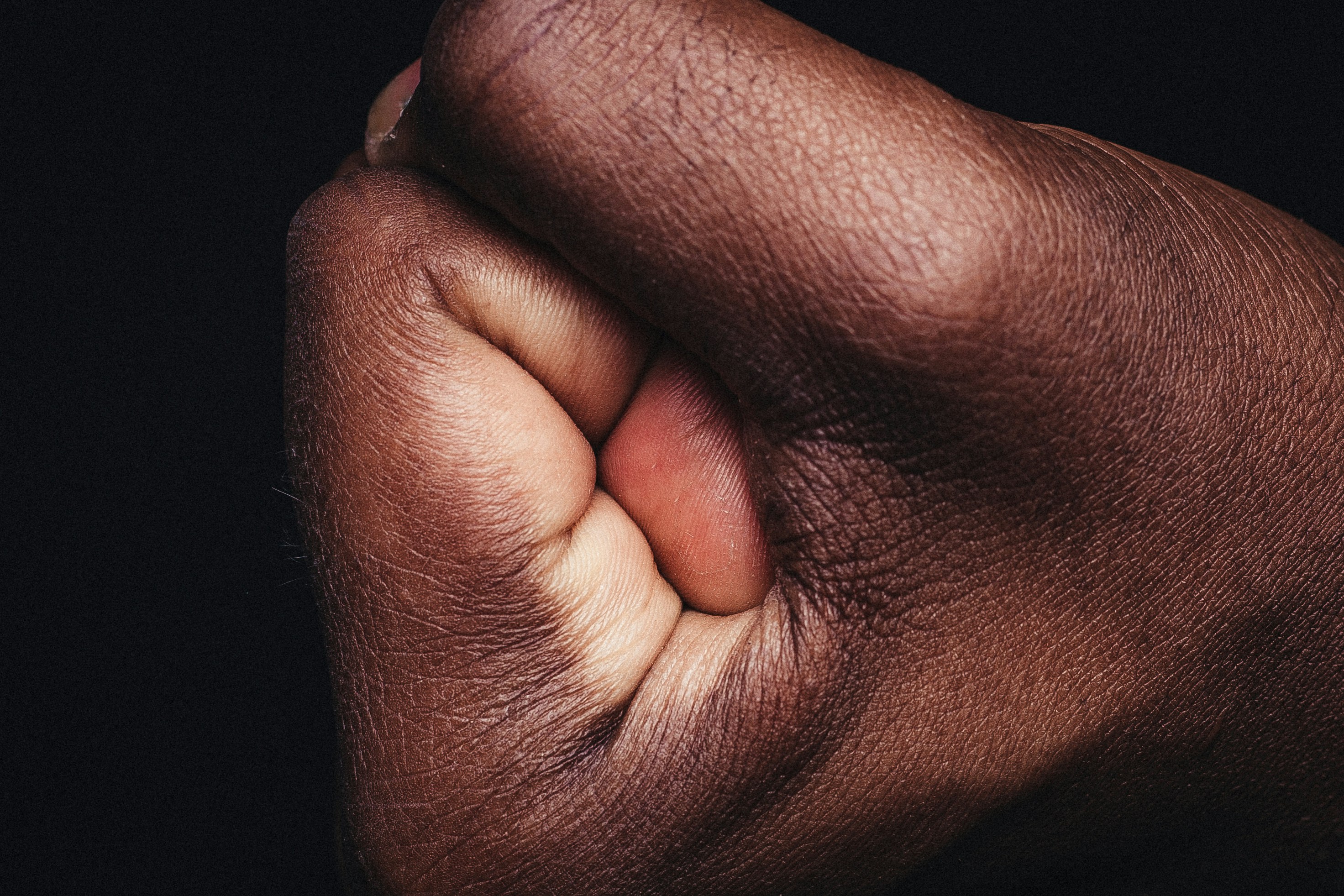 persons-hand-on-black-textile-photo-free-melanin-image-on-unsplash