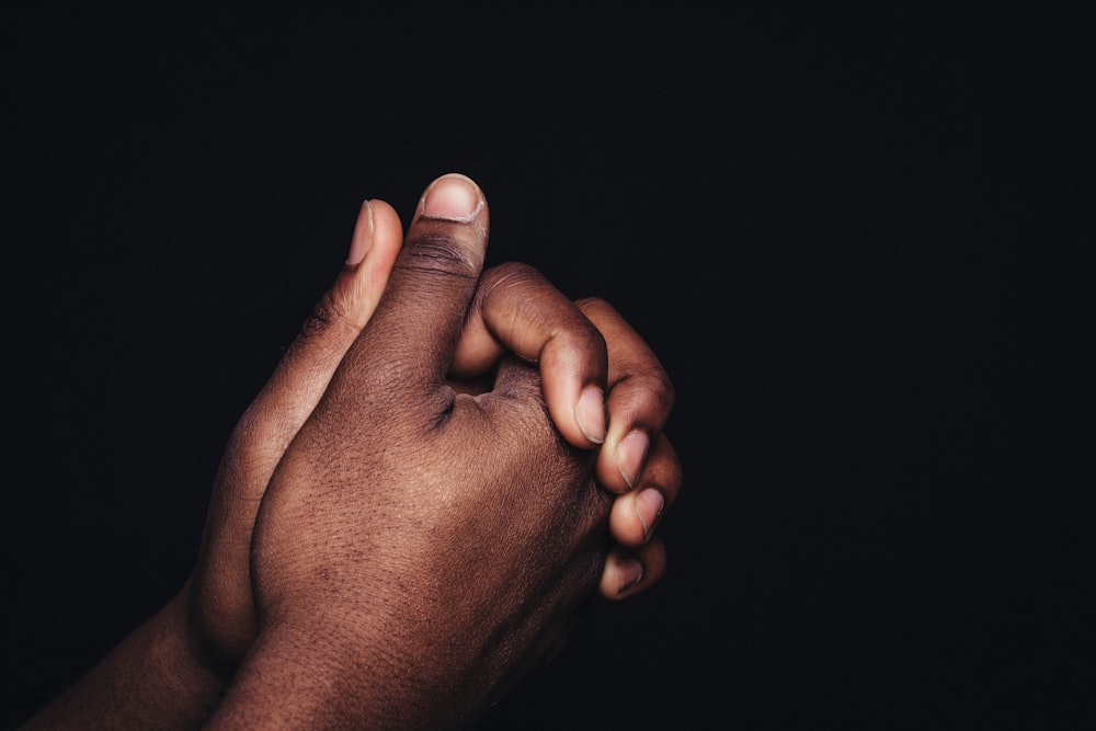 person holding babys hand