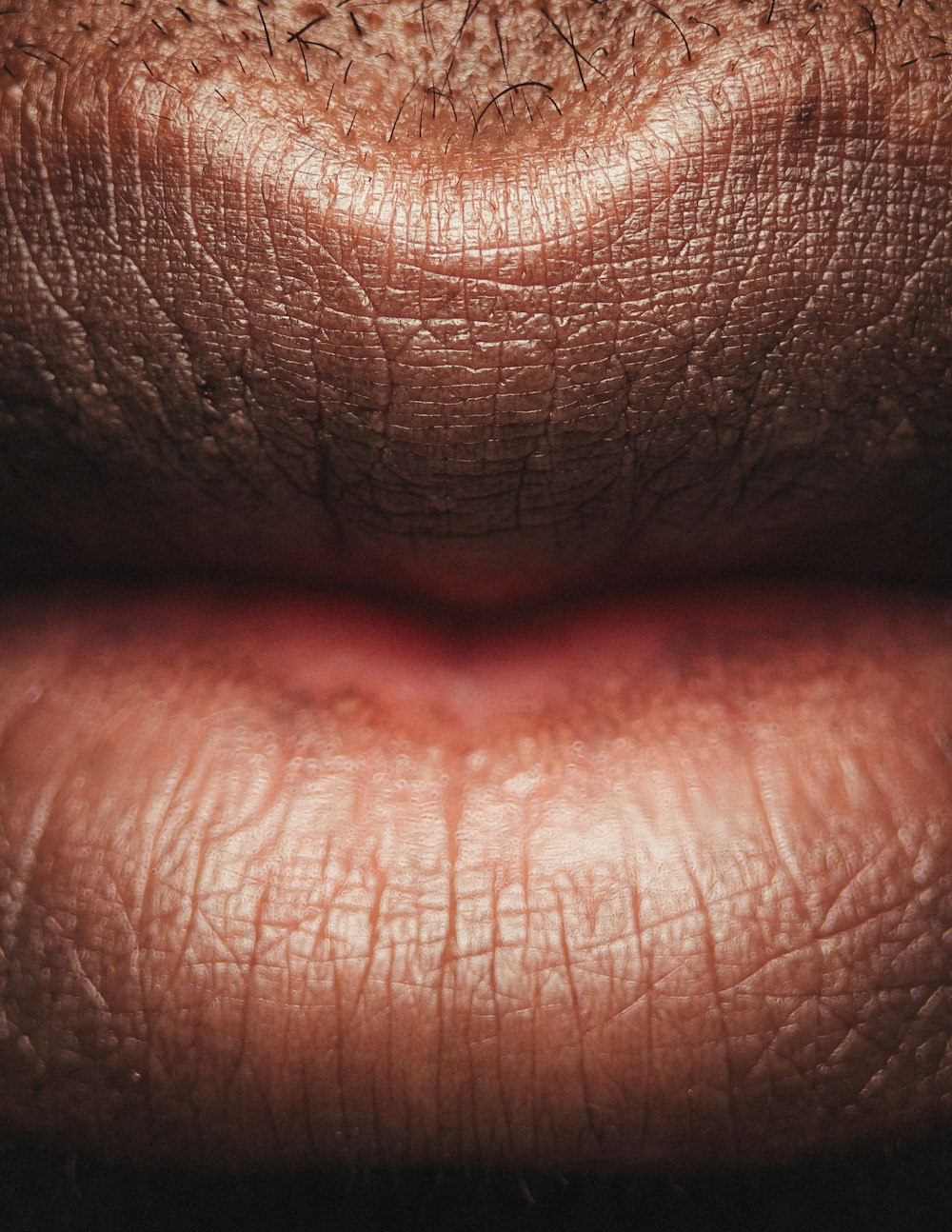 persons lip with red lipstick